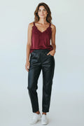 Plaza d'Amanté black faux leather joggers with an elastic waist, worn by a woman with a burgundy lace camisole.