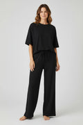 Plaza d'Amanté black relaxed fit lounge set with oversized crewneck t-shirt and wide-leg drawstring trousers