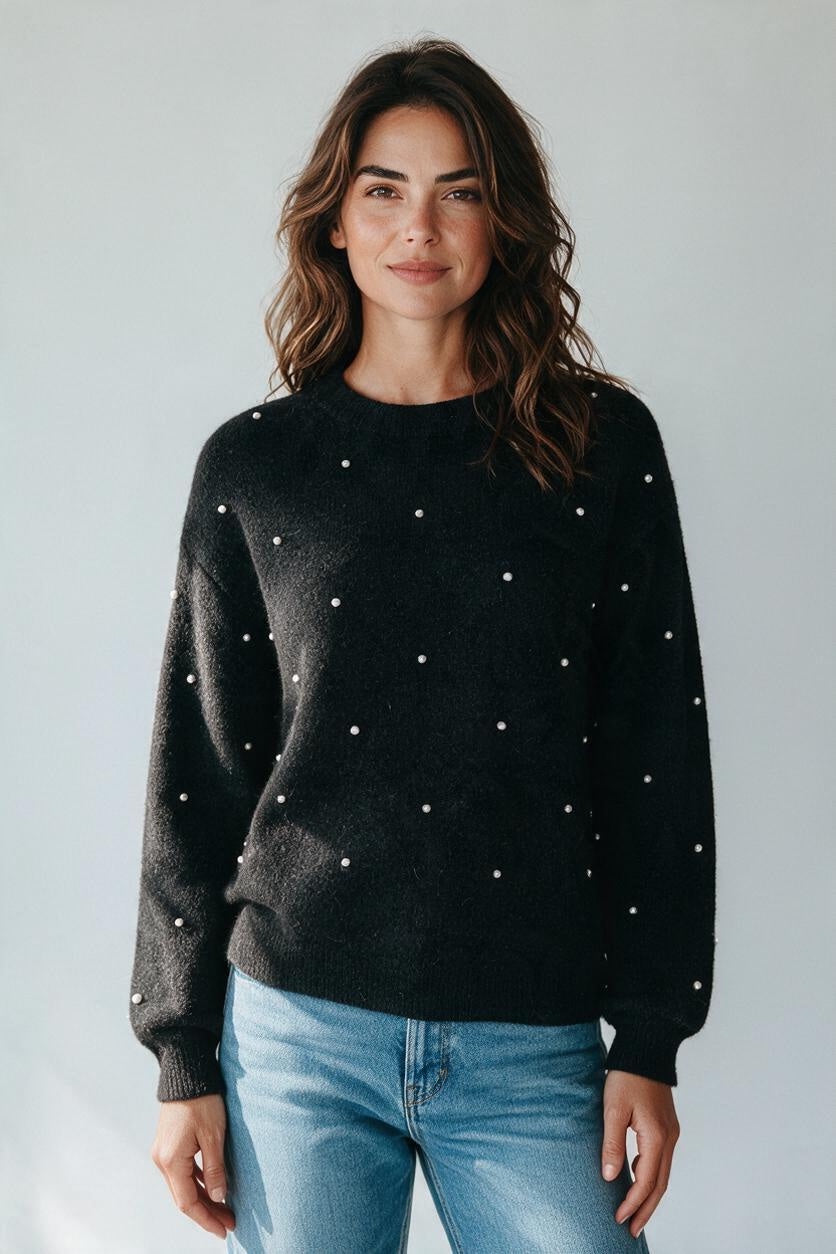 Plaza d'Amanté black knit sweater with scattered pearl embellishments, crew neck, and long sleeves on a model.
