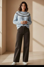 Plaza d'Amanté light blue fuzzy Fair Isle knit sweater with crew neck paired with dark trousers and white sneakers
