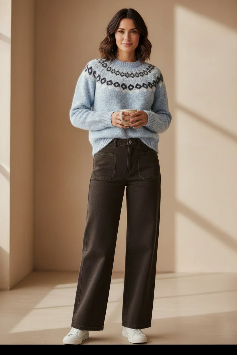 Plaza d'Amanté light blue fuzzy Fair Isle knit sweater with crew neck paired with dark trousers and white sneakers
