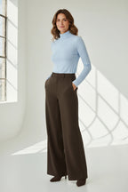 Plaza d'Amanté outfit featuring a light blue turtleneck sweater and high-waisted espresso brown wide-leg trousers.