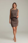 Model wearing a Plaza d'Amanté brown fuzzy knit sleeveless button-down top and matching mini skirt set.
