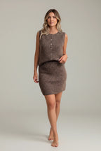 Model wearing a Plaza d'Amanté brown fuzzy knit sleeveless button-down top and matching mini skirt set.