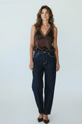 Plaza d'Amanté chocolate brown satin camisole with lace trim V-neck worn by a woman with dark denim jeans
