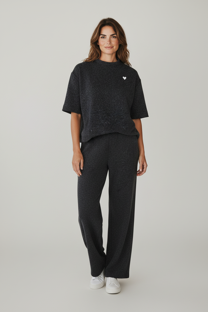 Plaza d'Amanté charcoal grey lounge set with mock-neck short sleeve top, heart embroidery, and wide-leg trousers.