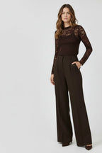 Plaza d'Amanté chocolate brown lace long-sleeve top and high-waisted wide-leg tailored trousers on a female model