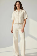 Plaza d'Amanté cream denim co-ord set featuring a short-sleeve button-down shirt and high-waisted wide-leg trousers.