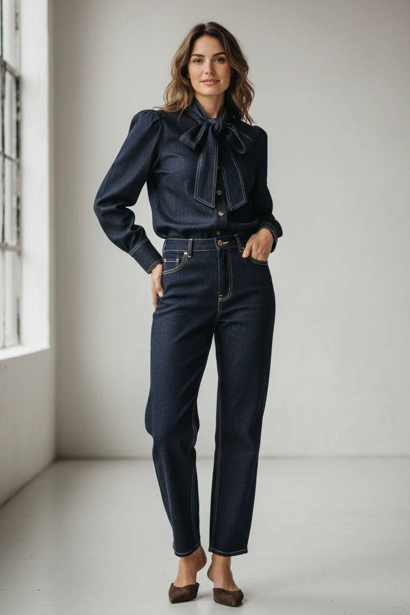 Plaza d'Amanté dark indigo denim blouse with pussy-bow neckline and matching high-waisted trousers with contrast stitch