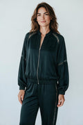 Plaza d'Amanté dark emerald satin bomber jacket with delicate lace shoulder inserts and a zip-front closure.