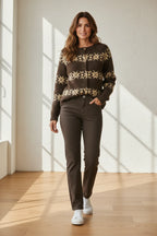 Plaza d'Amanté brown and cream Fair Isle button-front cardigan worn by a woman with dark jeans and white sneakers.