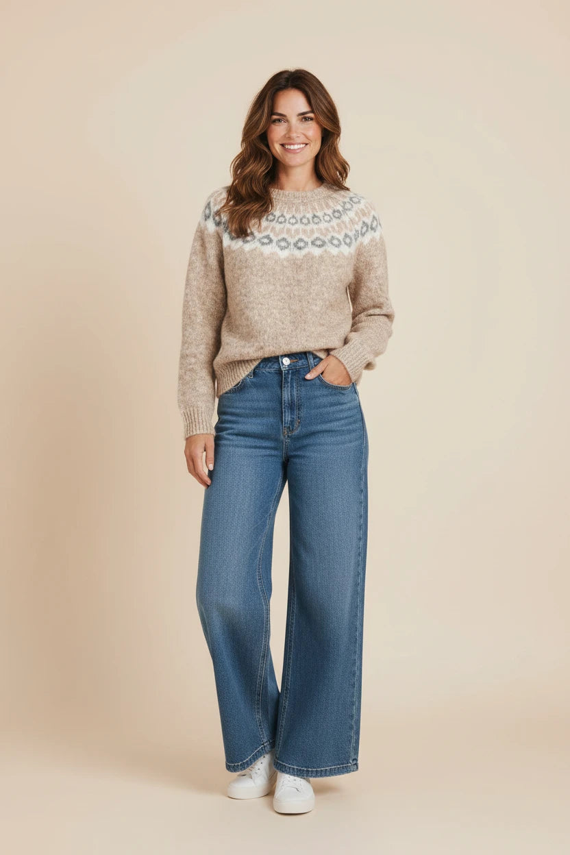 Plaza d'Amanté beige Fair Isle knit crewneck sweater with geometric yoke pattern worn with blue wide-leg jeans