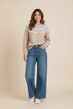 Plaza d'Amanté beige Fair Isle knit crewneck sweater with geometric yoke pattern worn with blue wide-leg jeans