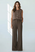 Plaza d'Amanté mocha knit button-front vest paired with dark brown wide-leg trousers on a smiling female model.