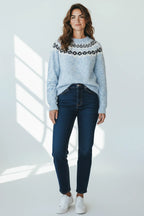 Plaza d'Amanté light blue crew neck knit sweater with a black and white Nordic geometric yoke pattern on a model.