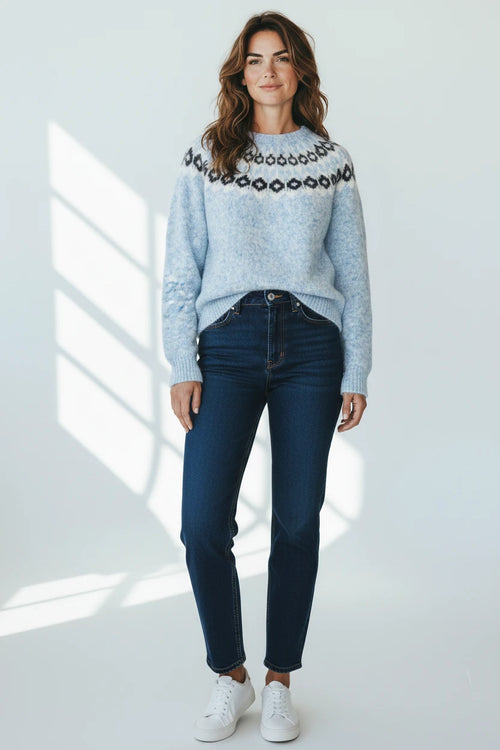 Plaza d'Amanté light blue crew neck knit sweater with a black and white Nordic geometric yoke pattern on a model.
