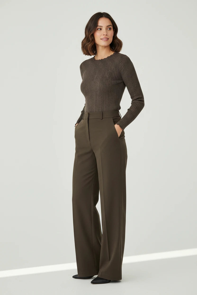 Plaza d'Amanté olive ribbed long-sleeve sweater and forest green high-waisted wide-leg tailored trousers on a model.