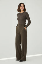 Plaza d'Amanté olive ribbed long-sleeve sweater and forest green high-waisted wide-leg tailored trousers on a model.