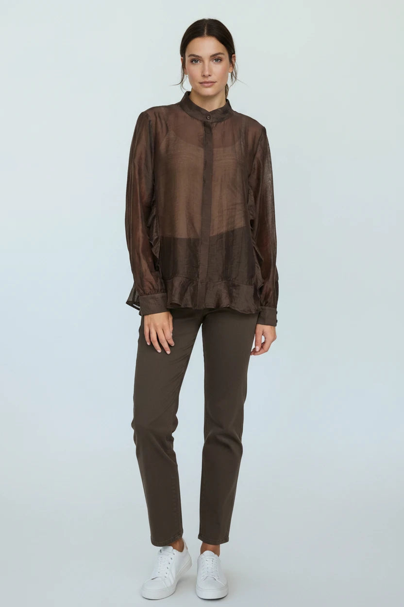 Plaza d'Amanté sheer chocolate brown long sleeve blouse with mandarin collar and gathered hem worn with dark trousers