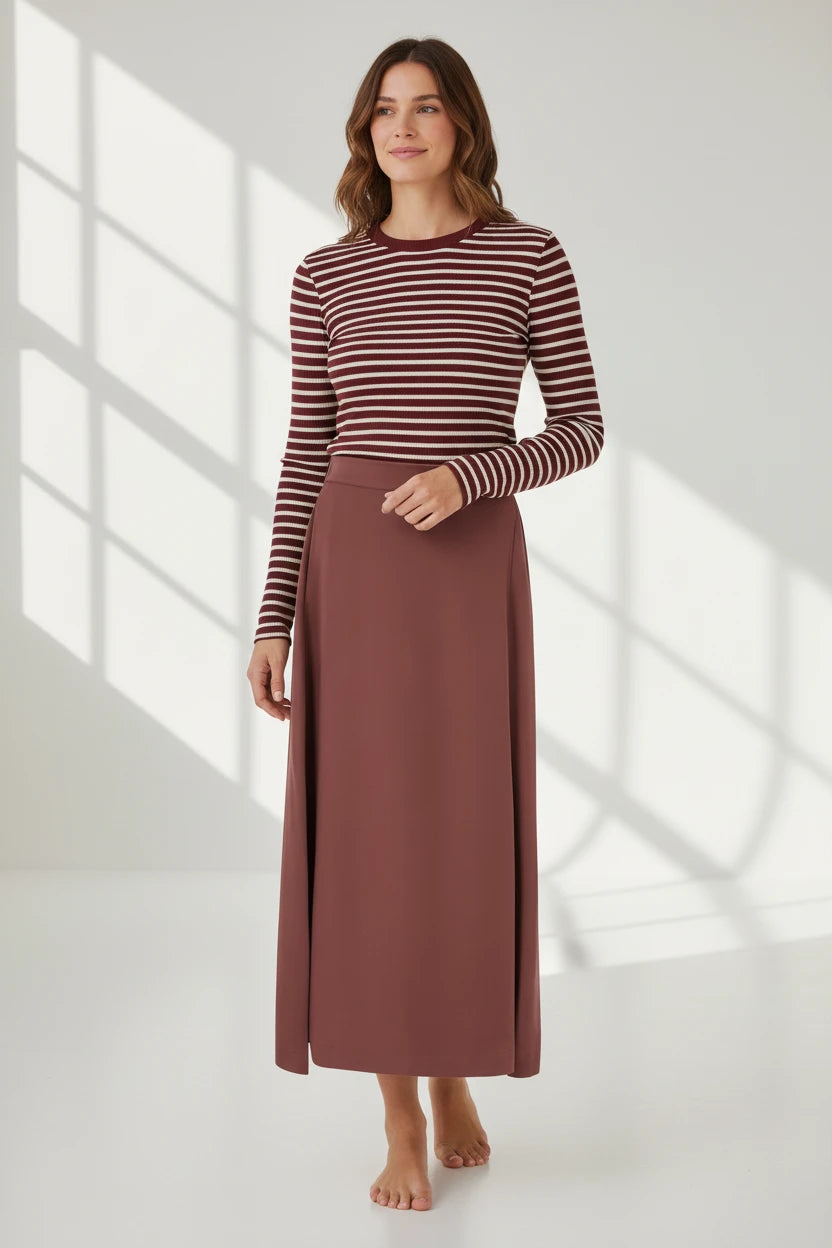 Plaza d'Amanté two-piece set with a burgundy and cream striped long-sleeve top and a solid mauve maxi skirt.