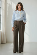 Plaza d'Amanté outfit featuring a light blue button-down shirt with lace collar and brown wide-leg tailored trousers.